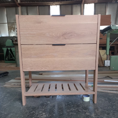 Custom solid wood vanity unit with two drawers and a slatted lower shelf